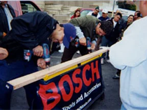 Participants trying power tools at a Bosch demonstration