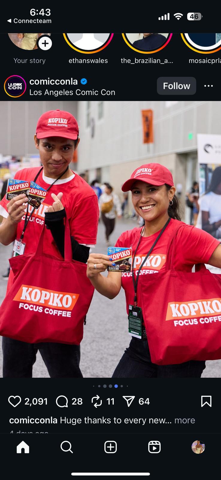 Kopiko brand ambassadors holding coffee candy at an event