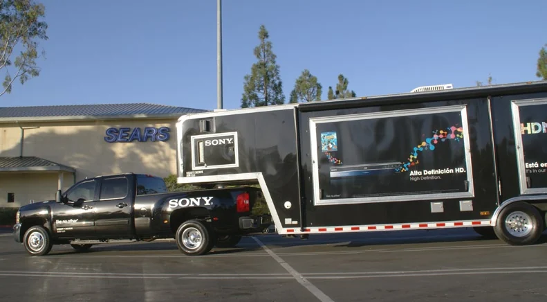 Sony roadshow truck and trailer outside a Sears store