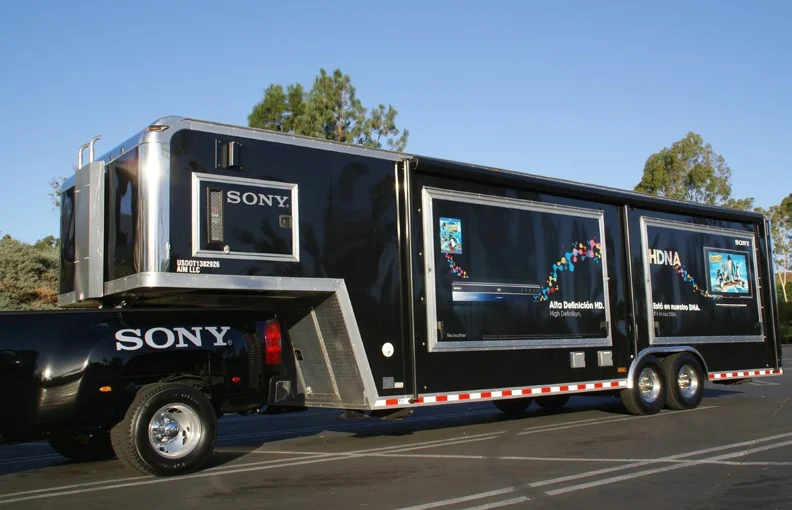 Front and side of the Sony trailer with part of the branded pickup visible